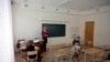 Latvia -- Inta Nogda, a teacher, holds a lesson in the primary school joint class with the few pupils in Merdzene near Karsava about 300 km (186 miles) east from capital Riga February 29, 2012.