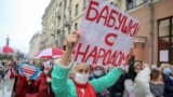 BELARUS -- Opposition supporters, mostly pensioners, attend a rally to reject the presidential election results in Minsk, Belarus October 12, 2020. The poster reads "Grand-moms with people"