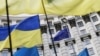 Ukraine -- Ukrainian national flags, flags of Ukrainian trade unions and EU flag are seen during a mass rally in front of the Ukrainian cabinet of ministers building in Kyiv, October 15, 2014