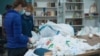 Ukraine -- volunteers of the Kiyev Sorting center "Ukraine without garbage" sorting out plastic bottles