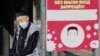 Kazakhstan. COVID-19 An elderly man is sitting at a bus stop. Almaty. September 8, 2020